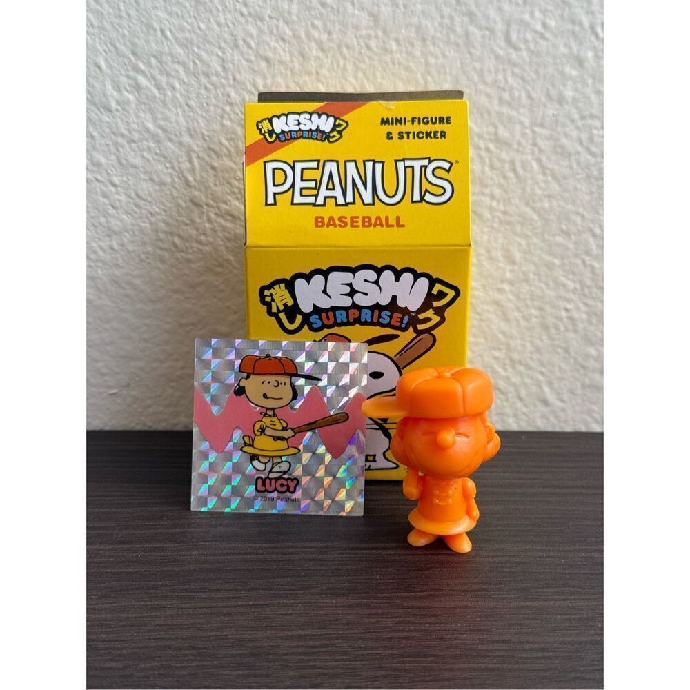 Super7 Peanuts Baseball Keshi Lucy Mini Figure & Sticker (Orange)